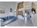 Living room with high ceilings and climbing wall at 182 Cantamar St, Henderson, NV 89074
