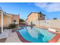 Inviting backyard pool and spa, surrounded by a brick border, complemented by a basketball hoop at 3610 El Camino Rd, Las Vegas, NV 89103