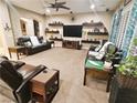 Bright and airy living room offering ample seating and stylish decor at 4242 Helena Hideaway Ct, Las Vegas, NV 89129