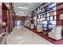 Elegant lobby space with wood paneling, modern lighting, plush seating, and a marble floor at 4575 Dean Martin Dr # 3007, Las Vegas, NV 89103