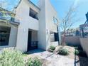 Modern home entrance with sleek design, desert landscaping, and a welcoming brick pathway at 483 Fairview Hills St, Las Vegas, NV 89138