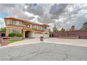 A spacious home with a three-car garage and a large driveway perfect for multiple vehicles at 6491 Bright Nimbus Ave, Las Vegas, NV 89139