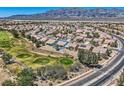 Expansive aerial view of home showcasing its location within a residential community and proximity to a golf course at 7567 Wingspread St, North Las Vegas, NV 89084