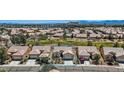 Charming single-story home with a well-manicured front yard and attached two-car garage in a planned community at 7567 Wingspread St, North Las Vegas, NV 89084