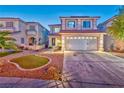 Charming two-story home features manicured lawn and a two-car garage at 7581 Slipstream St, Las Vegas, NV 89139