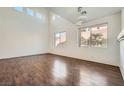 Bright living room with wood floors, modern lighting, and large windows providing ample natural light at 800 Fetter Ct, Henderson, NV 89052