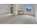 Bright living room features a fireplace and large windows offering ample natural light at 8805 Jeffreys St # 2082, Las Vegas, NV 89123