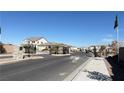 View of the decorative entrance to a residential neighborhood, featuring landscaping and attractive gates at 9189 Oakdale Ranch Ct, Las Vegas, NV 89139