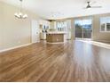 Spacious living room with wood floors, natural light, and open concept layout at 1001 Collingtree St, Las Vegas, NV 89145