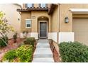 Inviting front entrance with landscaped walkway leading to the covered porch and front door at 10805 Knickerbocker Ave, Las Vegas, NV 89166