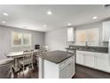 Kitchen island with granite countertops and stainless steel sink at 10805 Knickerbocker Ave, Las Vegas, NV 89166