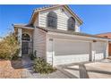 Charming two-story home featuring a three-car garage and a well-maintained walkway at 1209 Shifting Sands Dr, Las Vegas, NV 89108