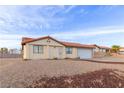 Charming single-story home featuring a tile roof, neutral stucco and a spacious two-car garage at 1892 Maricopa Dr, Laughlin, NV 89029