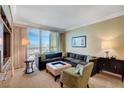 Elegant living room featuring floor-to-ceiling windows with city views, a sectional, and stylish decor at 2000 N Fashion Show Dr # 3921, Las Vegas, NV 89109
