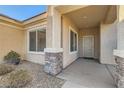 Inviting front porch with stone accents, providing a warm welcome to the home at 2384 Yellow Bird Ct, North Las Vegas, NV 89084