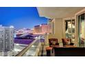 Balcony with patio seating that provides exceptional views of the lit up Las Vegas strip at 2857 Paradise Rd # 2103, Las Vegas, NV 89109