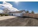 Lovely single-story home boasts a three-car garage with an extra wide driveway at 320 Cimmarron Pl, Pahrump, NV 89048