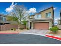 Attractive two-story house with desert landscaping, two-car garage, and modern architectural design at 340 Largo Vista Ct, North Las Vegas, NV 89084