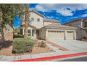Attractive two-story house with a three-car garage and neatly kept front yard at 4208 Lower Saxon Ave, North Las Vegas, NV 89085