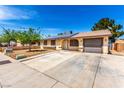 Well-maintained single-story home with solar panels, spacious driveway, and an attached garage at 4360 Wendy Ln, Las Vegas, NV 89115