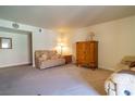Well-lit living room featuring neutral-colored walls and carpet flooring at 4411 Alexis Dr # 444, Las Vegas, NV 89103