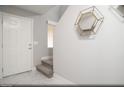 Inviting home entry with marble floors, staircase, and decorative mirror at 470 Ylang Pl # Lot 9, Henderson, NV 89015