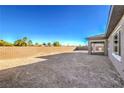 Expansive backyard with a brick wall, offering privacy and space for landscaping at 5846 Slate Rock Ct, Las Vegas, NV 89149