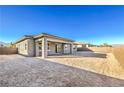 Large backyard with ample space and a covered patio, perfect for outdoor entertaining at 5846 Slate Rock Ct, Las Vegas, NV 89149