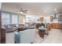 Open-concept living area blends the living room, dining space, and kitchen for easy entertaining at 609 Viale Machiavelli Ln, Henderson, NV 89011