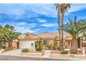Inviting single-story home with well-maintained desert landscaping and a spacious two-car garage under a sunny sky at 7613 Falconwing Ave, Las Vegas, NV 89131