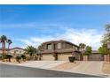 Attractive home boasts a spacious three-car garage, lush landscaping, and a private gated entrance, ensuring both curb appeal and security at 9108 Ghost Mountain Ave, Las Vegas, NV 89129