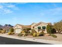 Stunning single-story home with a desert landscape, tile roof, and attached two car garage at 10548 Findlay Ave, Las Vegas, NV 89134