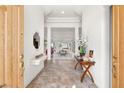 Bright foyer with tile flooring and views into the living area at 10548 Findlay Ave, Las Vegas, NV 89134