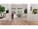 Open living room with neutral tones, stylish decor, and abundant natural light at 10548 Findlay Ave, Las Vegas, NV 89134