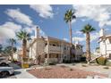 Attractive condominium building with manicured landscaping and stairs to upper units at 1333 Pinto Rock Ln # 202, Las Vegas, NV 89128