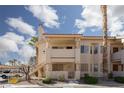Condominium building featuring a mix of lower and upper units with stairway access at 1333 Pinto Rock Ln # 202, Las Vegas, NV 89128
