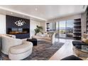 Bright living room with fireplace, comfortable seating, and scenic city views at 200 W Sahara Ave # 4101, Las Vegas, NV 89102