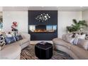 Cozy living room showcasing a modern fireplace, comfortable seating, and unique decor at 200 W Sahara Ave # 4101, Las Vegas, NV 89102