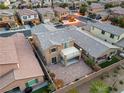 This aerial view shows a private backyard featuring a covered patio and lush landscaping in a desirable neighborhood at 2824 Shadows Edge Ct, Henderson, NV 89052