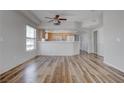 Bright, open-concept living room featuring wood-look flooring and natural light, complemented by neutral walls at 3604 Lisandro St # 204, Las Vegas, NV 89108