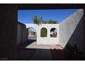 Arched entryway design frames a view of the street, complemented by unique stucco walls at 508 Van Dornum Ave, Henderson, NV 89011