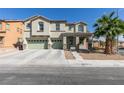 Traditional two-story home with a three-car garage and well-maintained front yard landscaping at 6220 Silver Edge St, North Las Vegas, NV 89031