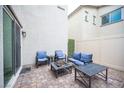 Private patio features outdoor seating with a fire pit, ideal for relaxing and entertaining at 6913 Evening Orchid St, North Las Vegas, NV 89086