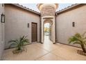 The entryway features a stone tower with an arched entrance at 7682 Rafter Ct, Las Vegas, NV 89139