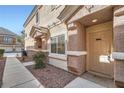 Welcoming townhome front entrance with landscaped walkway and cozy front porch at 1142 Heavenly Harvest Pl # 2, Henderson, NV 89002