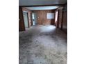 Living room featuring wood walls and a large open floor plan at 116 Continental Ave, Henderson, NV 89015