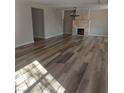Spacious living room featuring modern flooring, a cozy fireplace, and neutral wall colors at 1315 Wengert Ave, Las Vegas, NV 89104