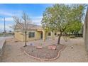 Spacious backyard featuring xeriscaping, a covered patio, and a serene outdoor space at 2084 Fort Halifax St, Henderson, NV 89052