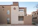 Unique condo with light stucco walls and contrasting trim with decorative facade features at 2969 Juniper Hills Blvd # 103, Las Vegas, NV 89142