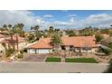 Expansive single-story home with a two-car garage, desert landscaping, and a red tile roof at 3236 Cliff Sieler Ct, Las Vegas, NV 89117